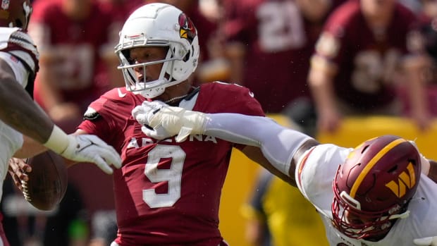 Arizona Cardinals quarterback Joshua Dobbs (9) is hit by Washington Commanders defensive tackle Jonathan Allen (93) during the second half at FedExField.
